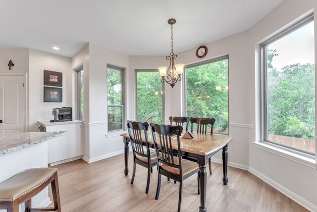 dining room featuring recessed lighting, baseboards, a chandelier, and light wood-style flooring