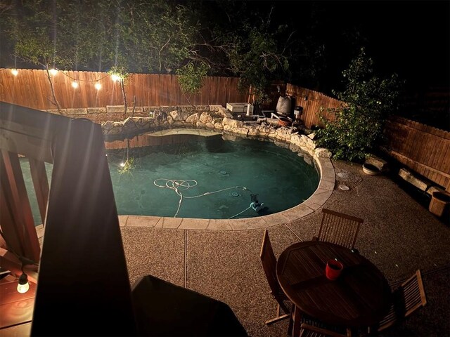 view of swimming pool with a fenced in pool and a fenced backyard