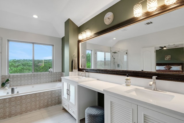 10636 Bramblecrest Dr, Austin, TX 78726 - full bath with vaulted ceiling, a shower stall, double vanity, a bath, and recessed lighting