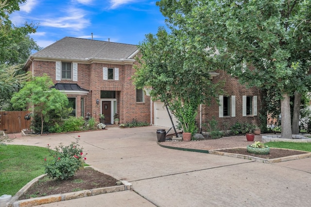 10636 Bramblecrest Dr, Austin, TX 78726 - view of front of property featuring driveway, brick siding, roof with shingles, and a garage