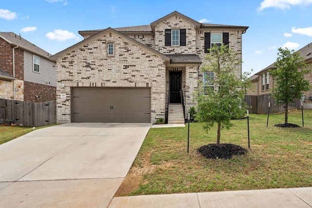 french country style house featuring brick siding, a front lawn, and fence