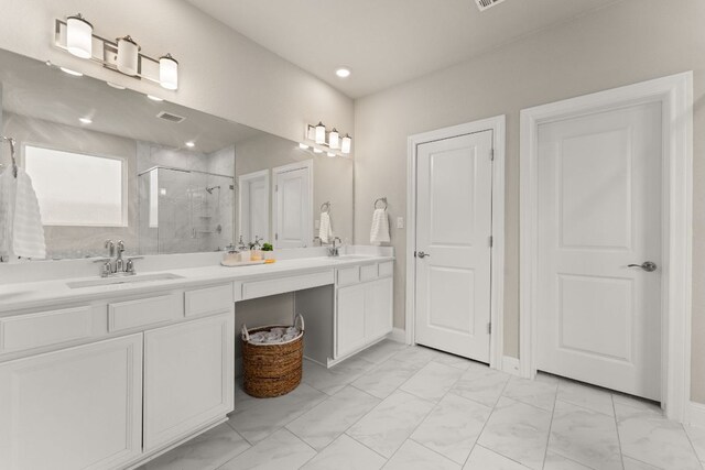 full bathroom featuring double vanity, visible vents, a sink, and a stall shower