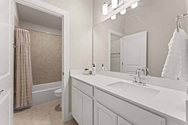 bathroom featuring vanity, tile patterned floors, toilet, and shower / bathtub combination with curtain