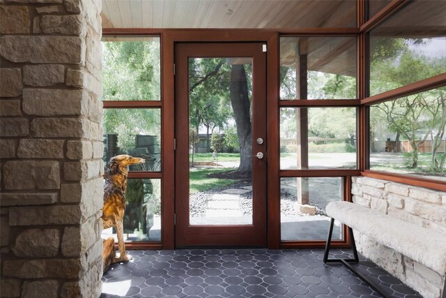 doorway with wooden ceiling