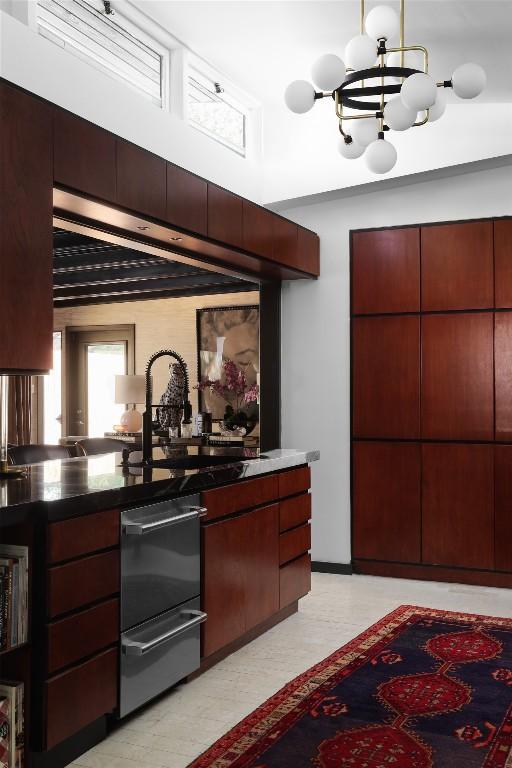 kitchen with an inviting chandelier and light floors