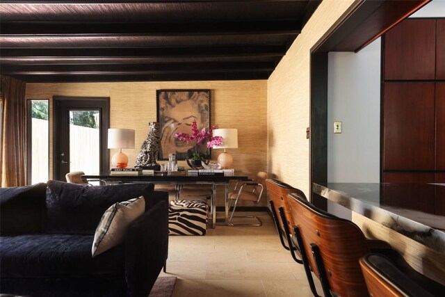 living area featuring beam ceiling