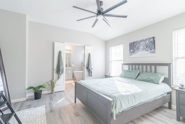 16100 S Great Oaks Dr Unit 3602, Round Rock, TX 78681 - bedroom featuring light wood-style flooring, vaulted ceiling, connected bathroom, and ceiling fan