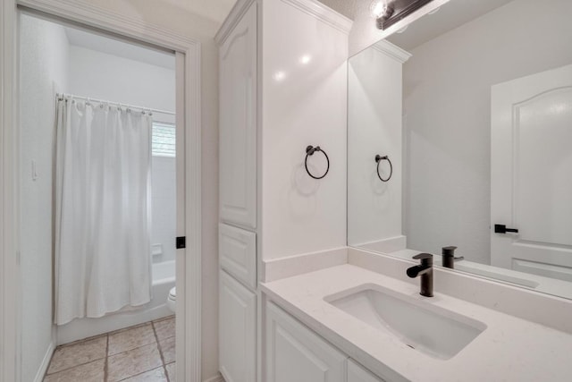 bathroom featuring vanity, toilet, and shower / bath combination with curtain