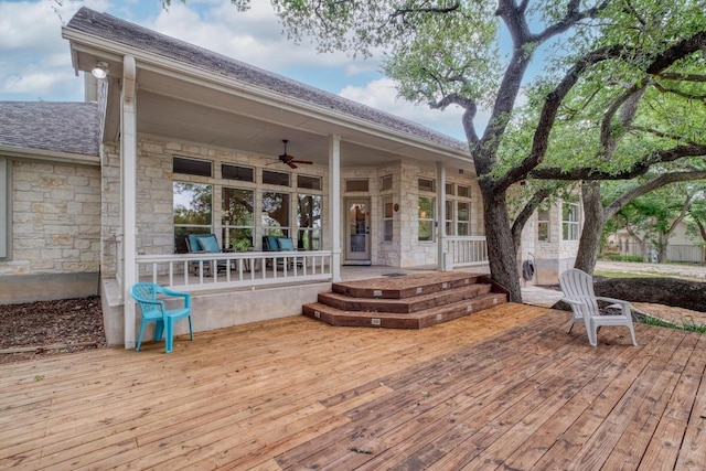 wooden deck featuring a ceiling fan