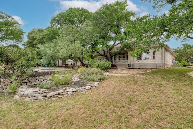 323 Allen Cir, Georgetown, TX 78633 - view of grassy yard featuring an outdoor pool