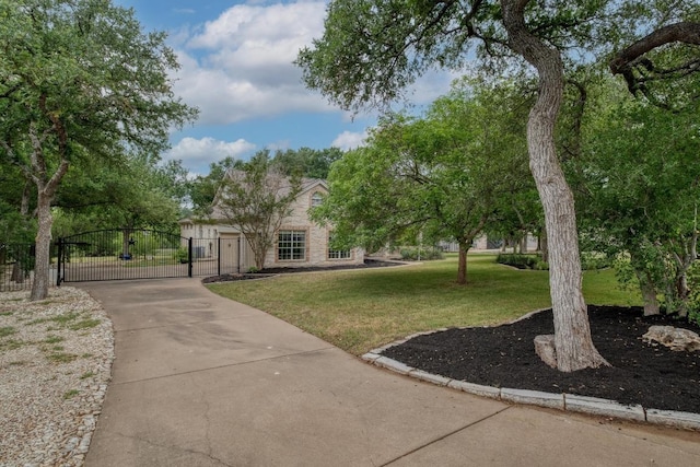 323 Allen Cir, Georgetown, TX 78633 - view of home's community with a gate and concrete driveway