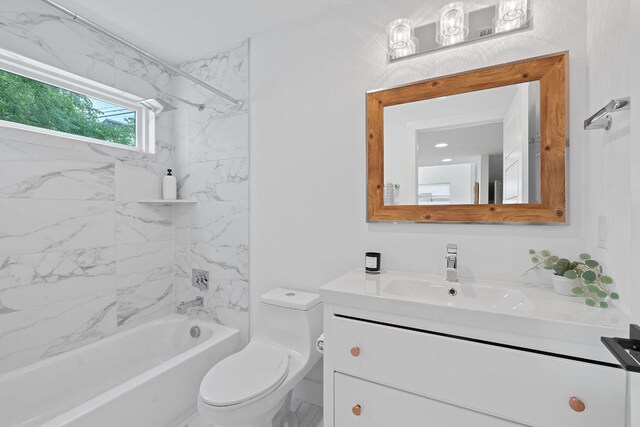 bathroom featuring vanity, toilet, and shower / tub combination