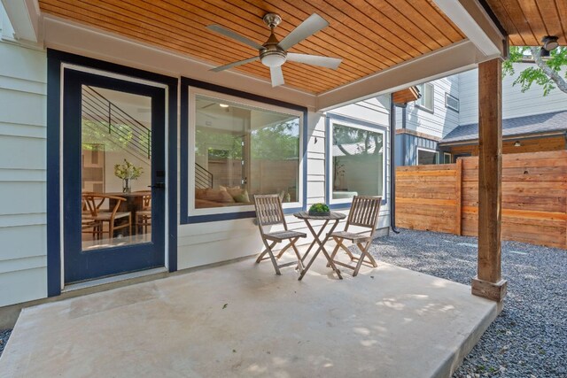 view of patio featuring fence and a ceiling fan