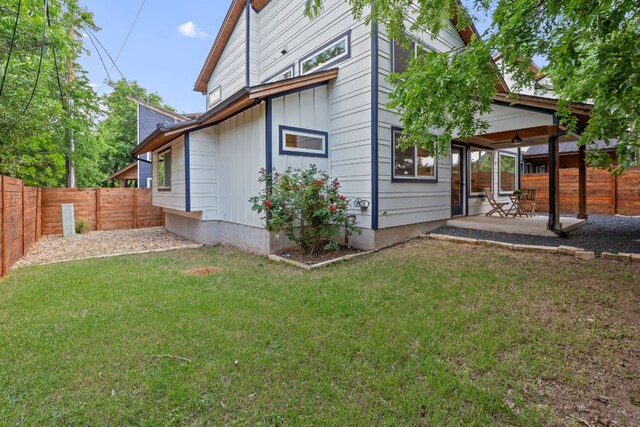 exterior space featuring a fenced backyard, a lawn, and a patio area