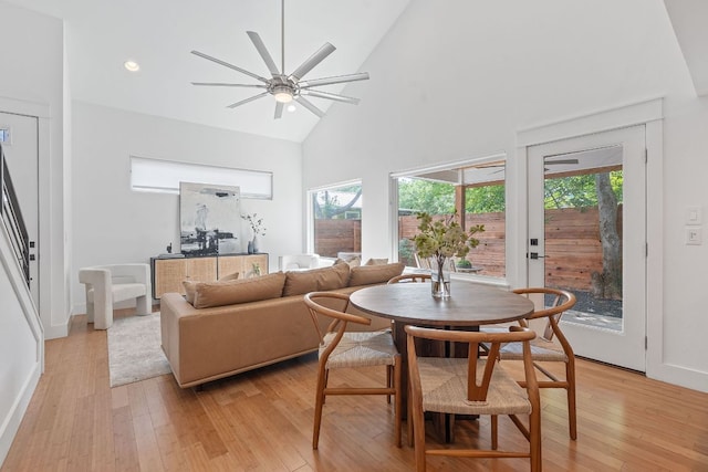 402 W 55th St Unit 2, Austin, TX 78751 - dining area featuring high vaulted ceiling, a ceiling fan, light wood-style flooring, stairway, and recessed lighting