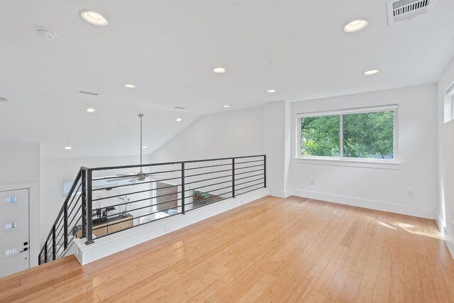 unfurnished room with visible vents, recessed lighting, baseboards, and wood finished floors