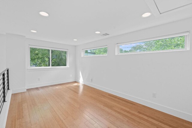 unfurnished room featuring baseboards, recessed lighting, light wood-style flooring, and visible vents