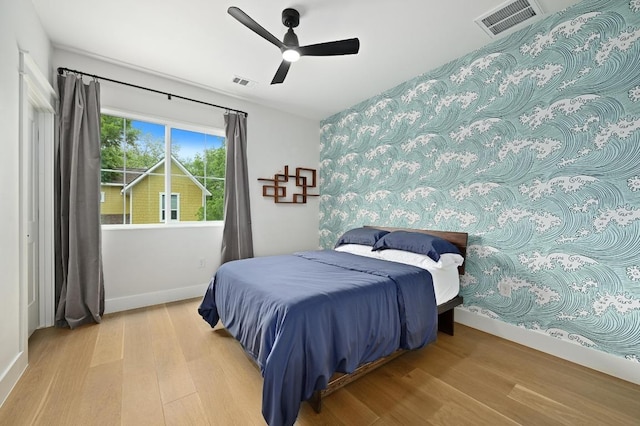 1815 Cullen Ave Unit 1, Austin, TX 78757 - bedroom featuring wood finished floors, baseboards, and ceiling fan