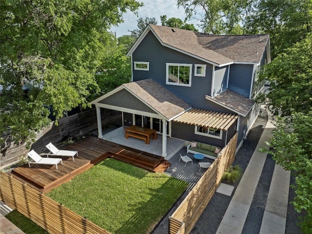 1815 Cullen Ave Unit 1, Austin, TX 78757 - rear view of house featuring roof with shingles, a deck, and an outdoor living space