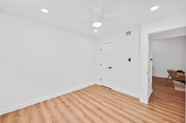 spare room featuring visible vents, recessed lighting, baseboards, and light wood-type flooring