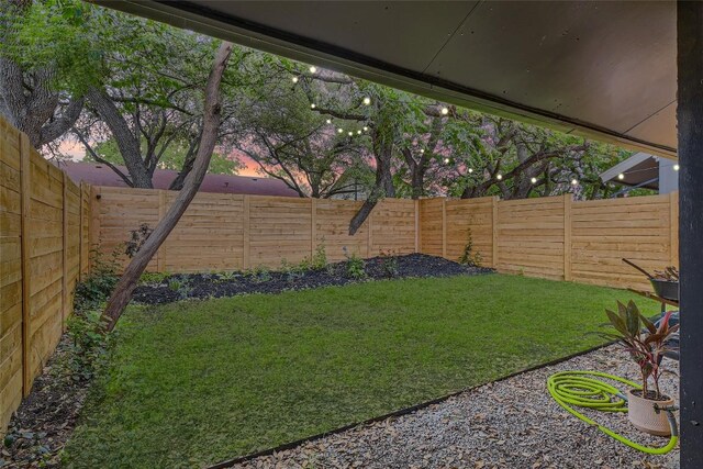 view of yard with a fenced backyard