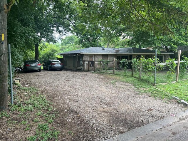 exterior space featuring fence and driveway