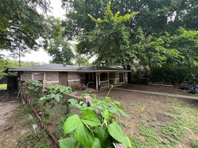 rear view of property featuring brick siding