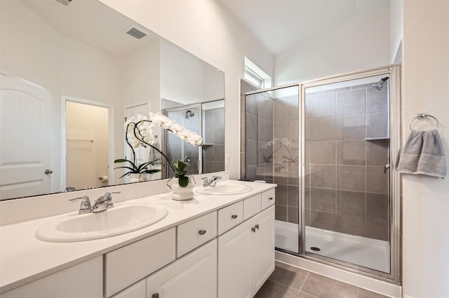 733 Melda St, Leander, TX 78641 - bathroom with a shower stall, tile patterned floors, and double vanity
