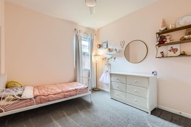 carpeted bedroom with baseboards