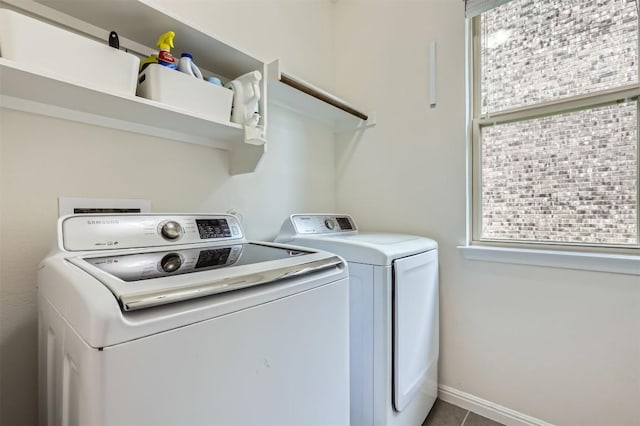 laundry room featuring washer and dryer, laundry area, and tile patterned floors