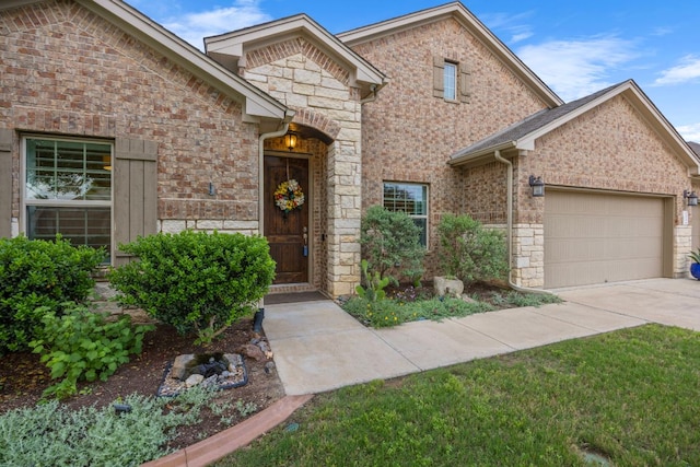 202 Parkwest Dr, Cedar Park, TX 78613 - traditional home with concrete driveway, brick siding, an attached garage, and stone siding