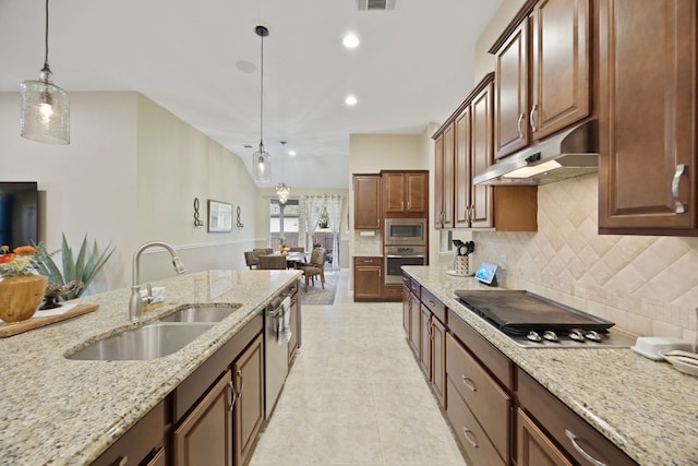 202 Parkwest Dr, Cedar Park, TX 78613 - kitchen featuring under cabinet range hood, a sink, backsplash, hanging light fixtures, and stainless steel appliances