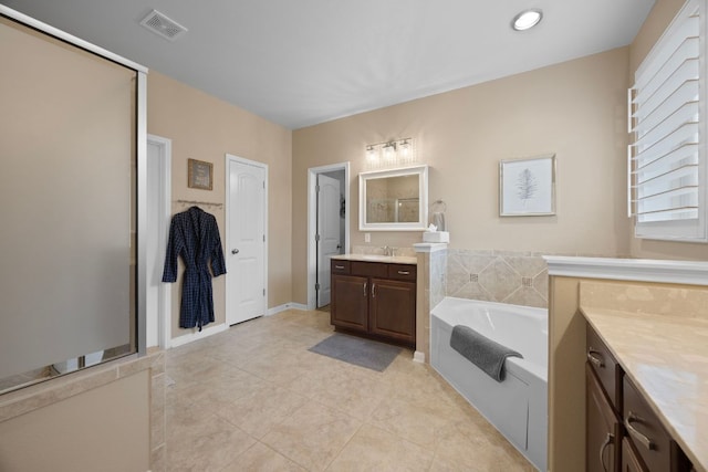 202 Parkwest Dr, Cedar Park, TX 78613 - full bath with tile patterned flooring, vanity, visible vents, a bath, and a stall shower