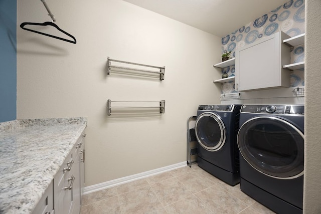 202 Parkwest Dr, Cedar Park, TX 78613 - laundry area featuring baseboards, cabinet space, light tile patterned floors, and washing machine and clothes dryer