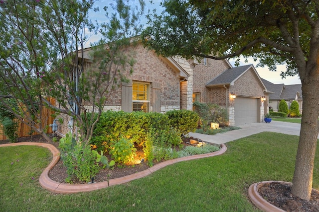 202 Parkwest Dr, Cedar Park, TX 78613 - view of front facade featuring a front yard, driveway, an attached garage, and stone siding