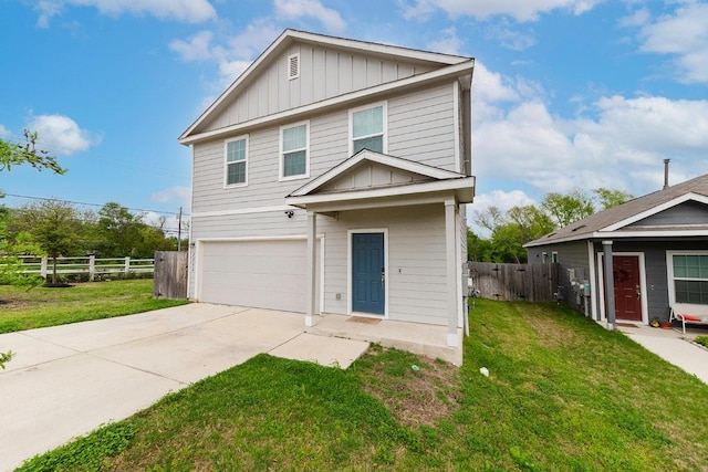 traditional-style home featuring board and batten siding, fence, a front lawn, and a garage
