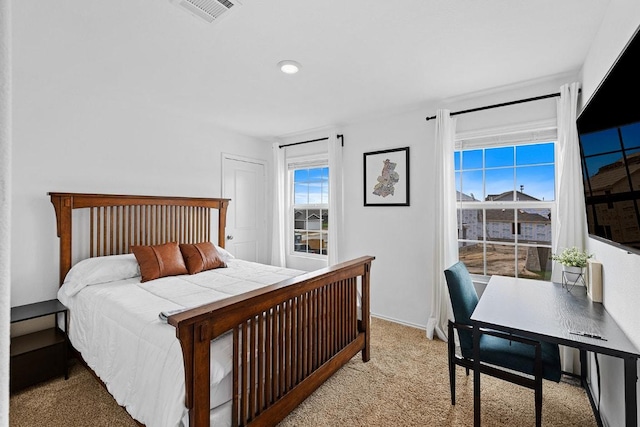carpeted bedroom with visible vents