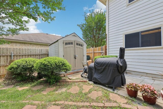 view of shed with fence