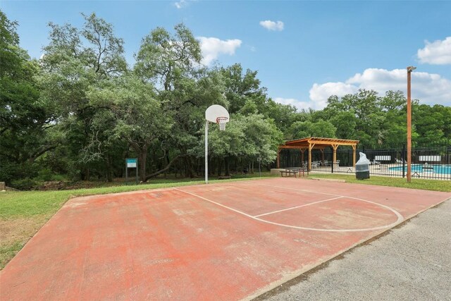 view of sport court featuring fence and community basketball court
