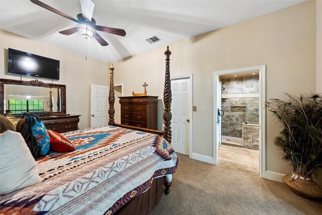 carpeted bedroom with baseboards, connected bathroom, ceiling fan, and visible vents