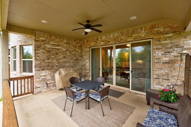 view of patio with outdoor dining area and ceiling fan