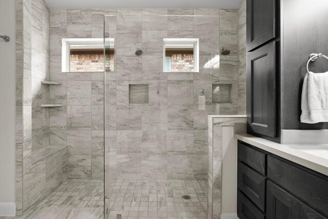 bathroom with vanity and a shower stall