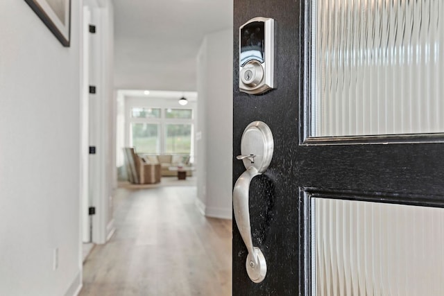 991 Hazy Hills Loop, Dripping Springs, TX 78620 - interior space featuring baseboards and wood finished floors