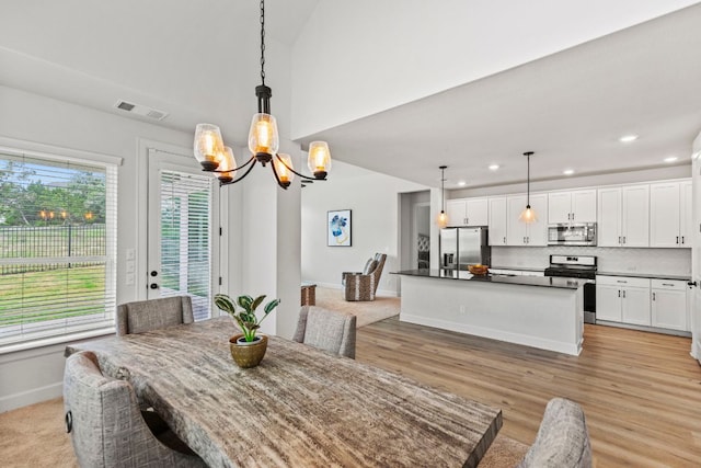 991 Hazy Hills Loop, Dripping Springs, TX 78620 - dining space featuring visible vents, baseboards, recessed lighting, a chandelier, and light wood finished floors