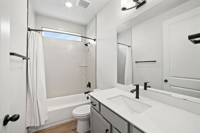 991 Hazy Hills Loop, Dripping Springs, TX 78620 - full bathroom with shower / bath combination with curtain, visible vents, wood finished floors, vanity, and toilet