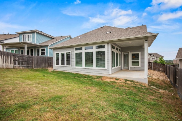 991 Hazy Hills Loop, Dripping Springs, TX 78620 - rear view of house with a fenced backyard, a shingled roof, a yard, and a patio area