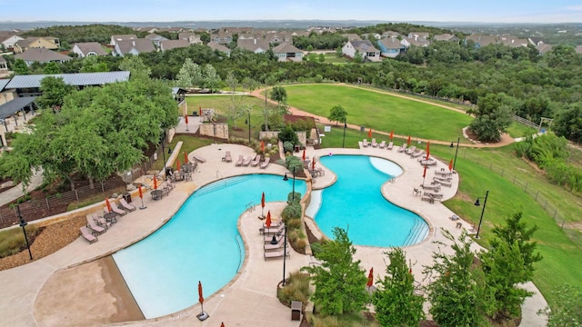 991 Hazy Hills Loop, Dripping Springs, TX 78620 - pool featuring fence, a yard, and a residential view