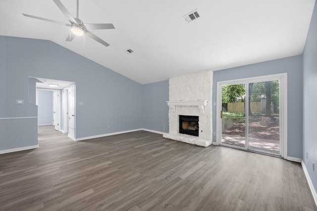 4411 Cumbria Ln, Austin, TX 78727 - unfurnished living room with ceiling fan, lofted ceiling, wood finished floors, and a fireplace