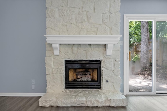 4411 Cumbria Ln, Austin, TX 78727 - detailed view of wood finished floors and a fireplace