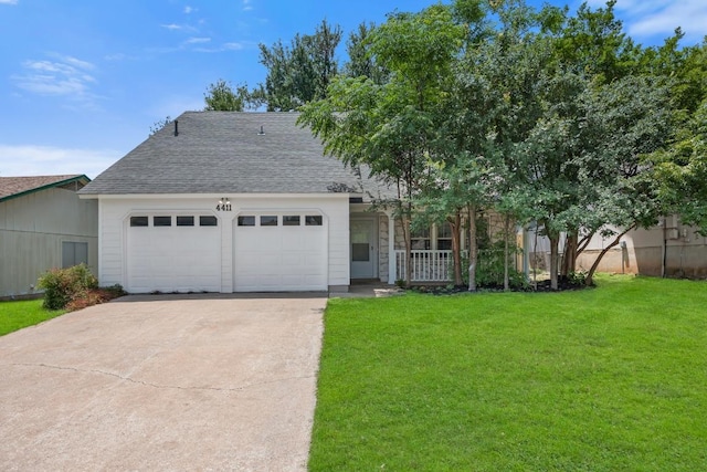 4411 Cumbria Ln, Austin, TX 78727 - view of front of house with a garage, driveway, a front yard, and roof with shingles
